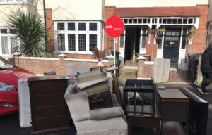 Furniture, mattresses and armchairs cleared from a terraced house after the property was sold